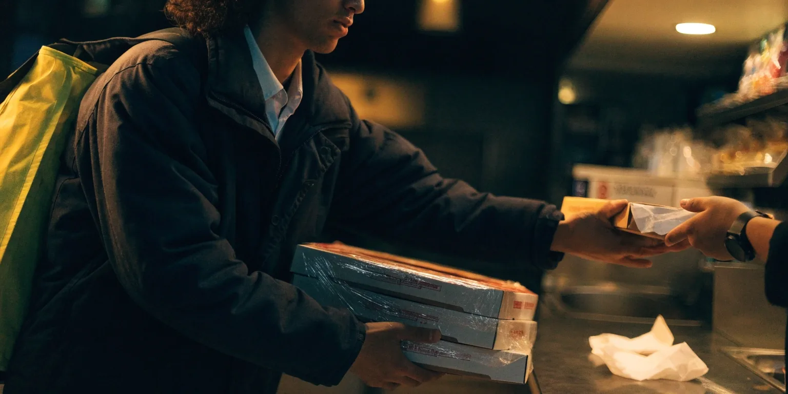 Half-open thermal delivery bag on a dark counter